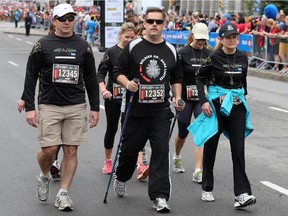 Frank Larabie leads a group during the half marathon (Injured Soldier) of the 2014 Canada Army Run held in Ottawa on September 21, 2014.