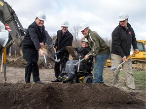 (from left) David Gourlay, President of Miracle League of Ottawa, Mayor Jim Watson, Bryce Desrochers, his dad Rolly, and Councillor Rainer Bloess turn the dirt in a groundbreaking ceremony for Ottawa's first, and Canada's second, Miracle League field located at Notre-Dame des Champs Park on Navan Rd.