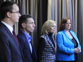 From left, four contenders for the leadership of the Ontario PC Party, Monte McNaughton, Patrick Brown, Christine Elliott and Lisa MacLeod, look on as fellow candidate, Vic Fideli, speaks at a breakfast event at the Marconi Centre in Ottawa Saturday, November 15, 2014.