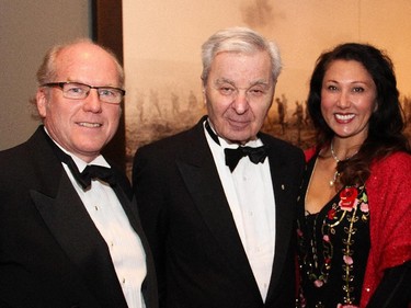 From left, prominent Ottawa arts patrons John Mierins, Bill Teron and Jamilah Murray at a special First World War commemorative evening held at the National Gallery of Canada on Monday, Nov. 10, 2014.