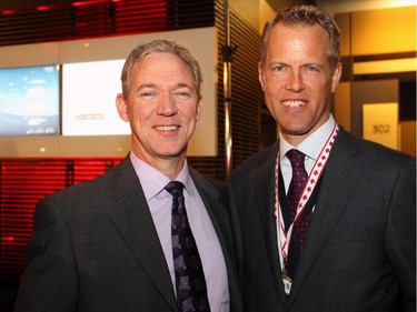 From left, Steve Spooner, CFO at Mitel Networks, with Michael Runia, Ontario managing partner of national presenting sponsor Deloitte, at the Gold Medal Plates fundraiser for Canadian Olympic athletes, held Monday, Nov. 17, 2014, at the Shaw Centre.