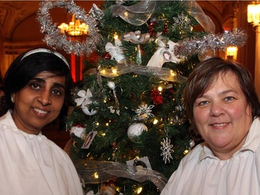 From left, Sujatha Kumar and Joyce Gorman from Keller Williams Ottawa Realty with their sponsored tree at the Trees of Hope for CHEO event held at and presented by the Fairmont Chateau Laurier on Monday, November 24, 2014.