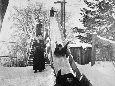 Members of the Oblate Fathers religious order circa 1937, sliding on the land they owned between Main Street and the Rideau River.