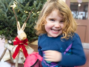 Hope Wilson, 3,  checks out the grand opening of the Ottawa Farmers Christmas Market held at the Aberdeen Pavilion, at Lansdowne Park Ottawa on November 30, 2014.