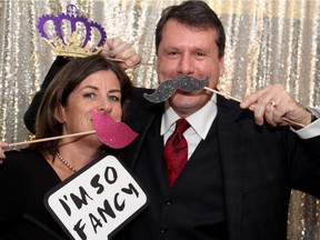 Jane Spiteri with her fun-loving husband, lawyer Chris Spiteri, at the photo booth for the Christie Lake Kids gala held at Ashbury College on Thursday, Nov. 6, 2014.