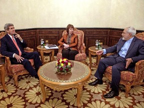 U.S. Secretary of State John Kerry, left, European Union High Representative Catherine Ashton, center, and Iranian Foreign Minister Mohammad Javad Zarif meet in Muscat, Oman, Monday, Nov. 10, 2014.