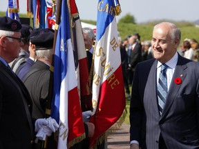 Julian Fantino, former Minister of Veterans Affairs, talks with French veterans during an official ceremony to commemorate the 97th anniversary of the battle of Arras and Capture of Vimy Ridge at the Canadian National Vimy Memorial, in Vimy, northern France, on April 9, 2014.