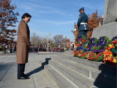 Liberal Leader Justin Trudeau takes a moment after placing a wreath during Remembrance Day ceremonies at the National War Memorial in Ottawa on Tuesday, November 11, 2014.