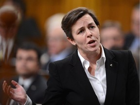 Minister of Labour and Minister of Status of Women Kellie Leitch responds to a question during Question Period in the House of Commons on Parliament Hill in Ottawa on Monday, October 21, 2013.