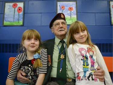 (L-R) Baillie (9) and Kally Bonacci (6) with their great grandfather Harold True, Korean war veteran, at Severn Avenue public school remembrance day ceremony on Nov. 11, 2014.