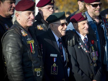 From left: Jim Summersides and Ralph Mayville, WWII veterans with The Black Devils took time for photos with other members of the Canadian Airborne Regiment at the Remembrance Day ceremony held at the National Military Cemetery at Beechwood Cemetery Tuesday November 11, 2014.