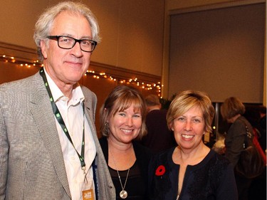 Lawyer Rick Brooks, past president of the TD Ottawa Jazz Festival board, with Jackie Legault and current board president Louise Meagher at the 17th annual jazz auction and benefit held at Library and Archives Canada on Thursday, Nov. 6, 2014.