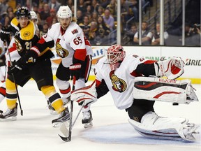 Ottawa Senators goalie can't stop a goal by Boston Bruins
