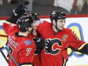 Mark Giordano, right, and T.J. Brodie have ignited the Flames' offence from the blue-line so far in the 2014-15 season.