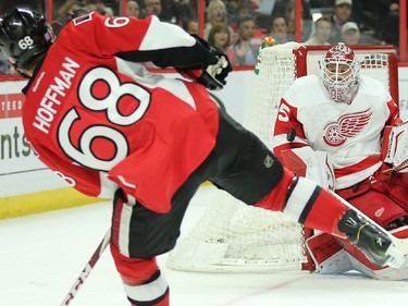 Mike Hoffman shoots on Jimmy Howard in the first period.