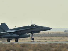 A Canadian Armed Forces CF-188 Fighter jet from 409 Squadron, touches down in Kuwait as part of the Canadian Air Task Force in support of Operation IMPACT on October 28, 2014.
 
Photo: Canadian Forces Combat Camera, DND
IS2014-5019-05