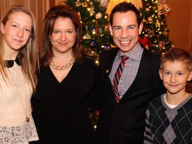 Organizer Deneen Perrin with Alex Munter, CEO of the Children's Hospital of Eastern Ontario (CHEO), and Perrin's daughter, Sophia Michel, 14, and son, Alex Michel, 10, a former CHEO patient, at the Trees of Hope for CHEO fundraiser held at and presented by the Fairmont Chateau Laurier on Monday, November 24, 2014.