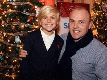 Ottawa investment advisor Dean Usher with his son, Dane, nine, at the Trees of Hope for CHEO event held at the Fairmont Chateau Laurier on Monday, November 24, 2014.