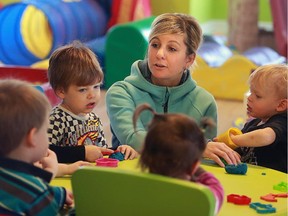 OTTAWA ,January 23/2014-  from left to right  are Mason Dalmage 3, Calvin Boudrias 3, Tracy Boudrias  and Griffin Bougie (20months) story about home daycare and changes proposed by the Ontario government.Tracy Tracy Boudrias operates a home daycare in Carleton Place Photo by Bruno Schlumberger/Ottawa Citizen assgt 115907