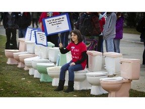 Rita Hafizi and other University of Ottawa Students gathered on the front lawn of Tabaret Hall for World Toilet Day to raise awareness of the lack of sanitation in the world. (Chris Mikula / The Ottawa Citizen)