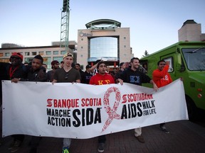 September 14, 2013 -  Members of a Carleton University Frat, Kappa Sigma, march along with hundreds of others through the streets of downtown Ottawa to raise awareness and money to fight AIDS, during the AIDS walk for life on Saturday, September 14, 2013.