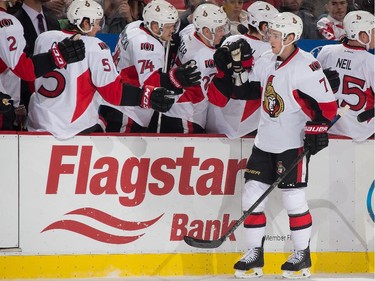 Kyle Turris #7 of the Ottawa Senators celebrates his first period goal with teammates on the bench.