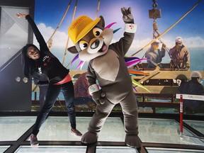 Olympian and Pan Am Games athlete Perdita Felicien poses for a photo with Toronto 2015 Pan Am/Parapan Am Games mascot Pachi the porcupine at the CN Tower.