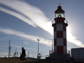 People walk away from the lighthouse on display at the Canada Science and Technology museum in Ottawa on Friday, November 12, 2010. One of Ottawa's major museums is closing for an indefinite period due to unacceptable levels of airborne mould.