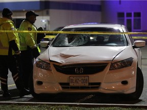 Police investigate a fatal crash in which a pedestrian, a man in his 20s, died after being struck by a car on Innes Road on Saturday, Nov. 29, 2014.