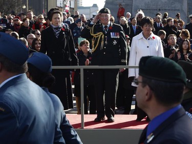 Princess Anne, Governor General David Johnston, and Silver Cross Mother Gisele Michaud watch the parade of veterans and soldiers at the National War Memorial in Ottawa on Tuesday, November 11, 2014.