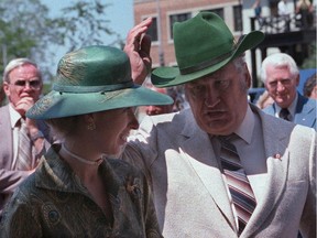 Princess Anne compares toppers with Agriculture Minister Eugene Whelan during a visit to the Experimental Farm in Ottawa on July 5, 1982.