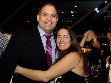 Saskatchewan MP Rob Clarke got a big hug from former Olympic gold medalist Katie Weatherston (hockey) at the Gold Medal Plates benefit dinner held at the Shaw Centre on Monday, November 17, 2014.
