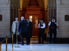 Security guards the entrance to the parliamentary library in the House of Commons on Thursday October 23, 2014 in Ottawa.