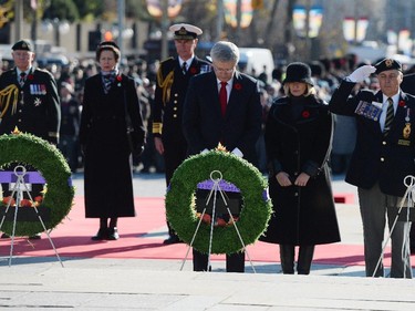 Prime Minister Stephen Harper and wife Laureen take a moment after placing a wreath during Remembrance Day ceremonies at the National War Memorial in Ottawa on Tuesday, November 11, 2014.