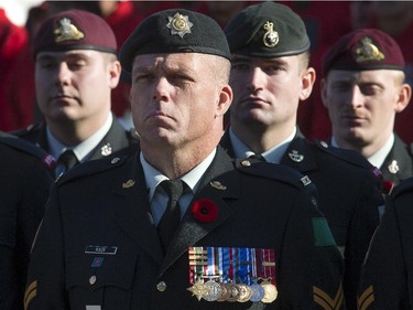 Sun catches the medals on Cpl Klack's chest as the annual Remembrance Day Ceremony takes place at the National War Memorial in Ottawa. Assignment -