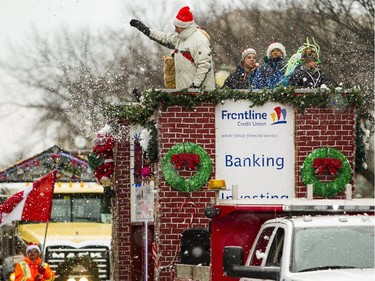 The only snow was fake snow from this float during the 2014 Ottawa Professional Fire Fighters' Association's Help Santa Toy Parade in Ottawa Saturday