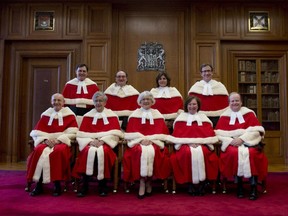 The Supreme Court Justices pose for a group photo at the Supreme Court of Canada Monday October 6, 2014 in Ottawa. Back Left: Justice Richard Wagner, Justice Michael J. Moldaver, Justice Andromache Karakatsanis, Justice Clement Gascon. Front Left: Justice Marshall Rothstein, Justice Louis LeBel Chief Justice Beverly McLachlin, Justice Rosalie Silberman Abella Justice Thomas Albert Cromwell.