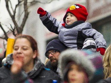 Thousands of people filled the sidewalks to watch the 2014 Ottawa Professional Fire Fighters' Association's Help Santa Toy Parade in Ottawa Saturday