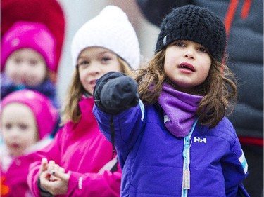 Thousands of people filled the sidewalks to watch the 2014 Ottawa Professional Fire Fighters' Association's Help Santa Toy Parade in Ottawa Saturday