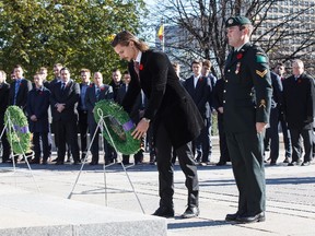 Ottawa Senators captain Erik Karlsson lays a wreath at the National War Memorial on Sunday,  Nov. 9, 2014.