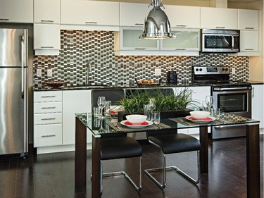 Upgraded kitchen cupboards in bright white add a flash of contrast in the Surrey.