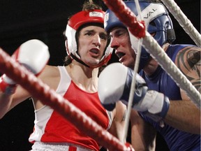 Liberal MP Justin Trudeau, left, fights Conservative Senator Patrick Brazeau during charity boxing match for cancer research Saturday, March 31, 2012 in Ottawa.