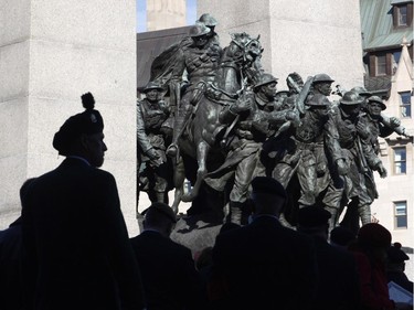 Veterans gather around the National War Memorial at the Remembrance Day ceremony in Ottawa on Tuesday, November 11, 2014.
