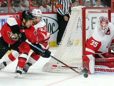 With Darren Helm close behind, David Legwand attempts a wrap around with Jimmy Howard getting his blocker down in time in the third period.