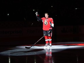 Daniel Alfredsson salutes the crowd as he was honoured prior to the game against the New York Islanders.