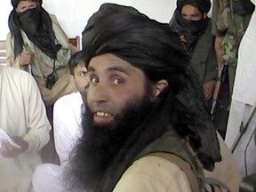 This frame grab taken November 11, 2013,from 2008 video footage shows Maulana Fazlullah, newly appointed chief of Tehreek-e-Taliban Pakistan (TTP), speaking with local journalists in the Pakistan's northwestern Swat valley.