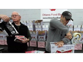 Volunteers sort and package boxes at the Ottawa Food Bank.
