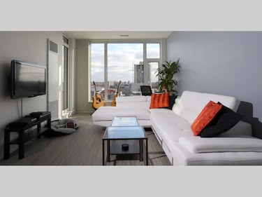 A wall of windows offers spectacular views from the open-concept living room.