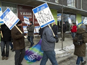 Corrections officers press for a better contract offer outside the office of Yasir Naqvi on Catherine Street on Dec. 8.