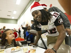 Redblacks player Jamill Smith signed autographs and handed out team towels to grade one and two students enjoying a Christmas lunch at St. Elizabeth School.